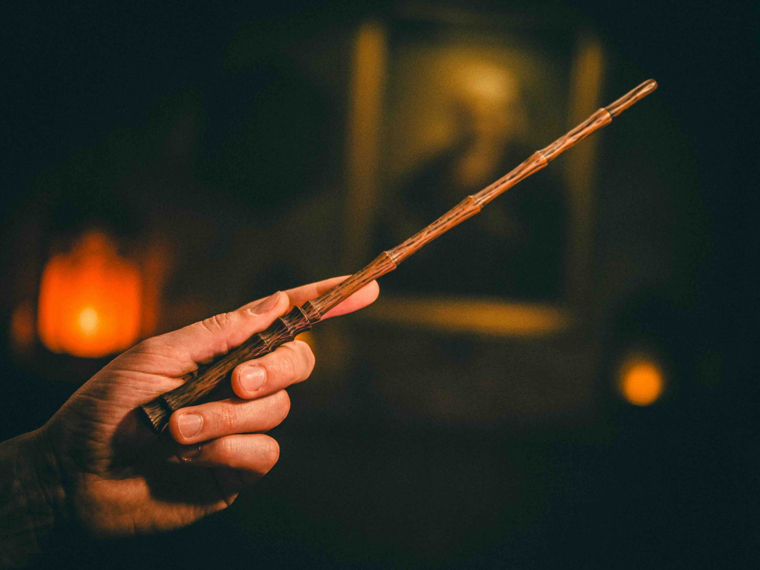 Dragon & Elder Magic Wand being held by a wizard, showcasing its intricate design and powerful craftsmanship for spellcasting.