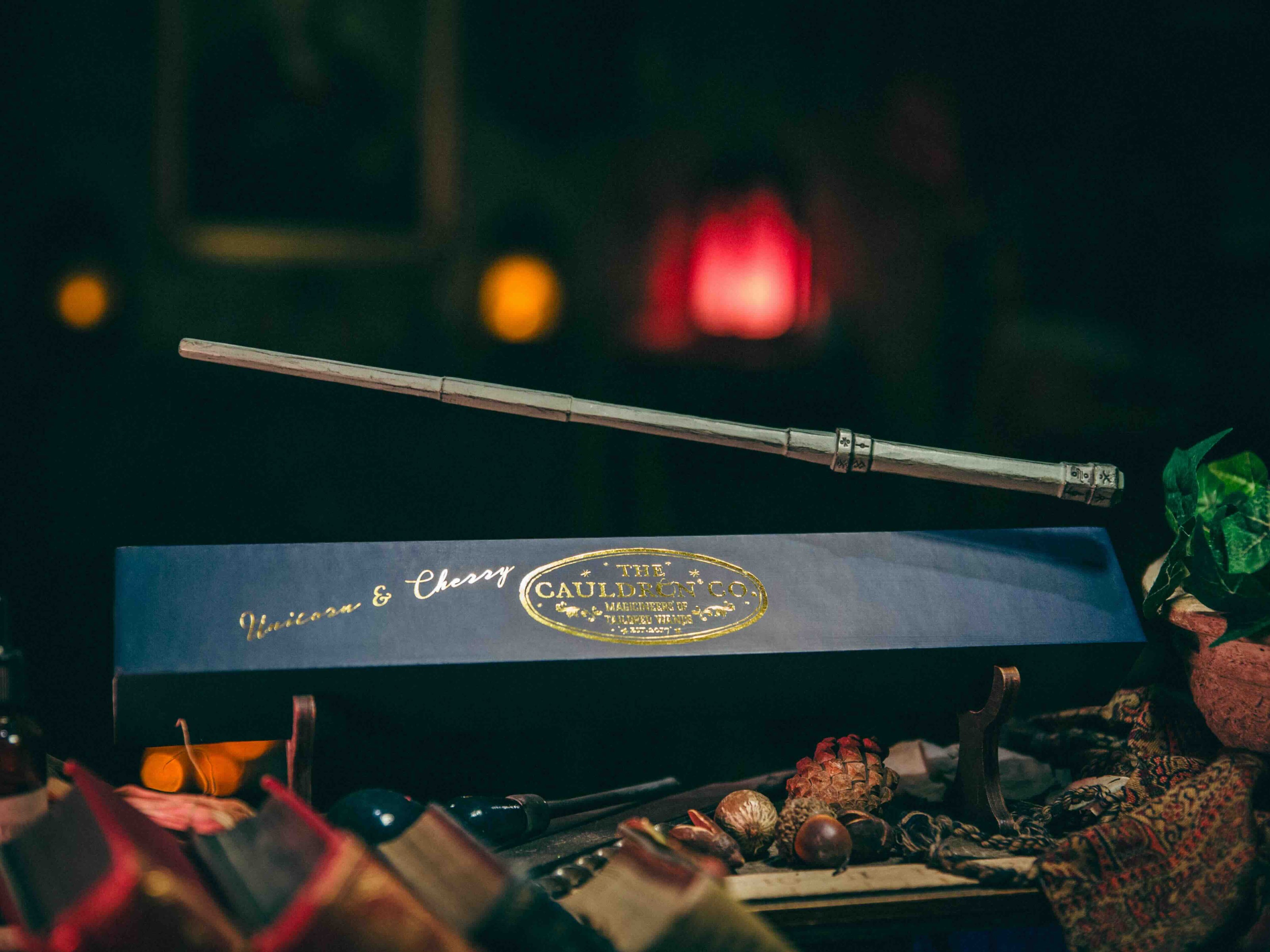 Unicorn & Cherry Magic Wand floating above its box, radiating hidden power and mystical energy.