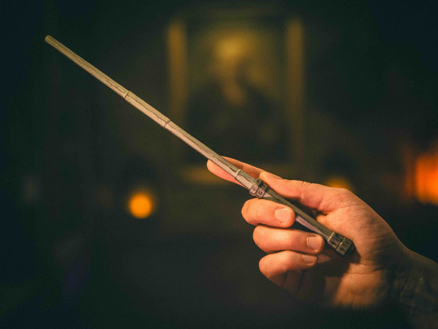 Unicorn & Cherry Magic Wand being held by a wizard, designed for unlocking hidden magical powers and mysteries.